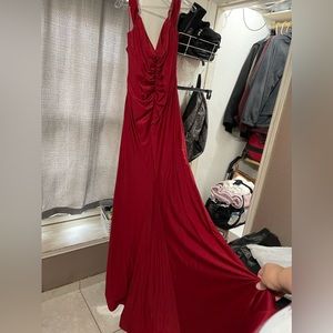 Burgundy shimmery mermaid dress with train and thigh slit.